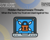 Hidden ransomware threats article title photo. This includes the Computer Solutions logo, tagline, and contact information, as well as a graphic of a computer that has been locked by outside forces and used for ransom.